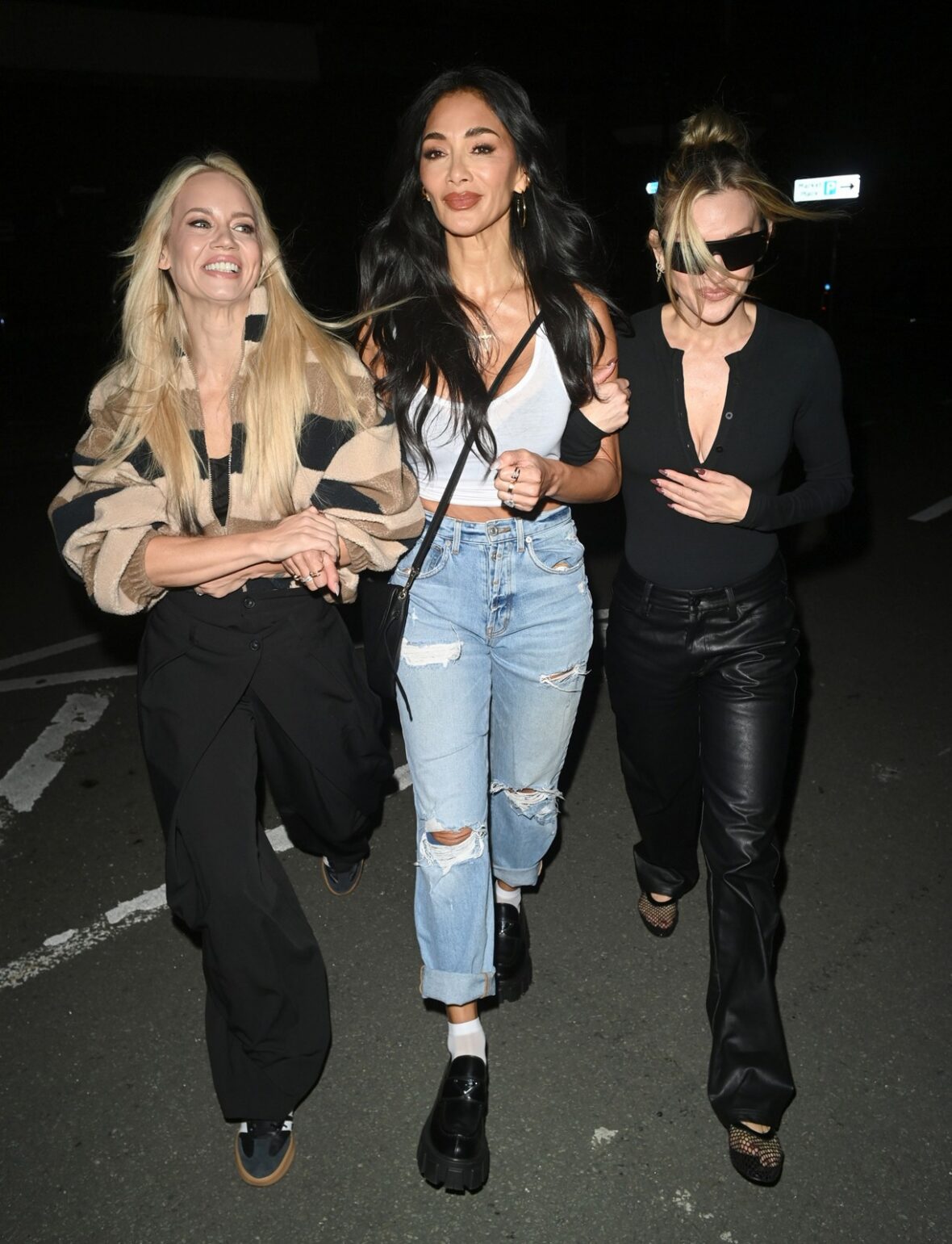 Pussycat Dolls Nicole Scherzinger, Ashley Roberts, and Kimberly Wyatt enjoyed a night on the town in Manchester on Thursday.