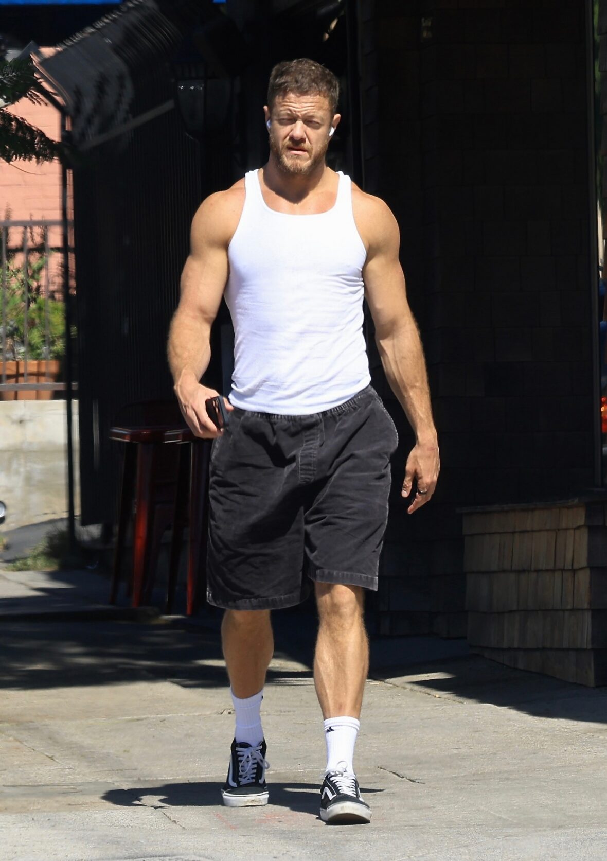 Dan Reynolds runs errands in a tank top