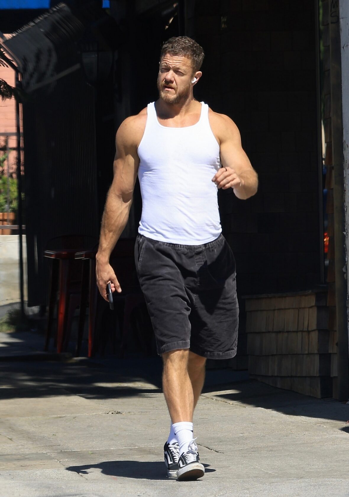 Dan Reynolds runs errands in a tank top