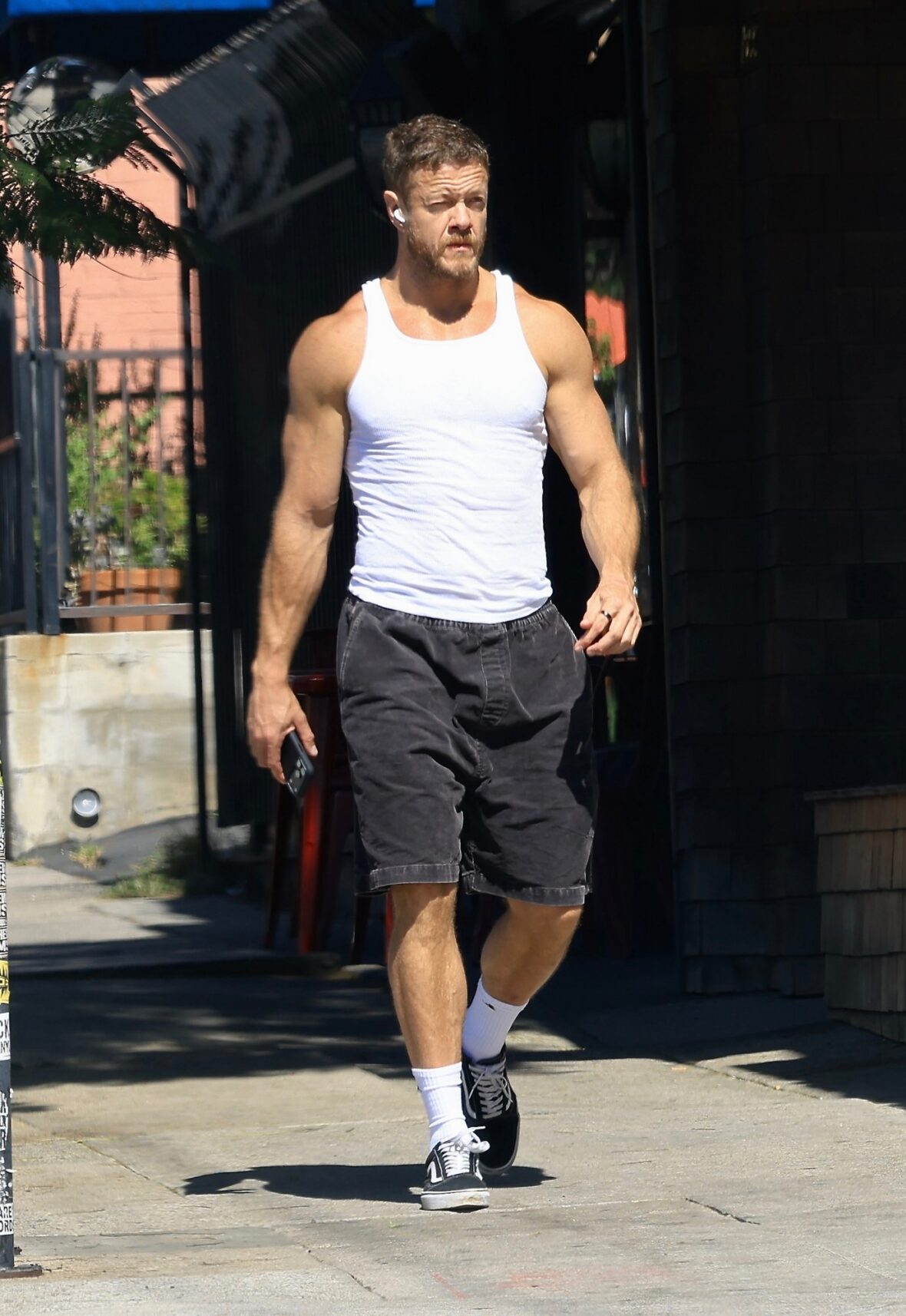 Dan Reynolds runs errands in a tank top