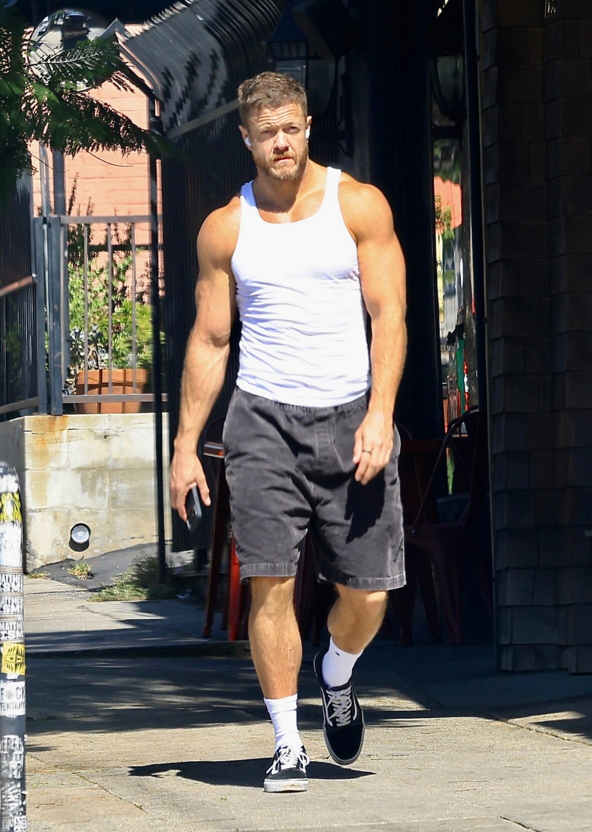 Dan Reynolds runs errands in a tank top