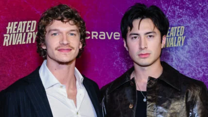 Connor Storrie and Hudson Williams pose at the Heated Rivalry premiere