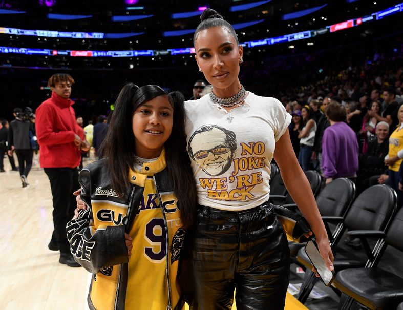 Kim Kardashian and North West attend the Lakers game