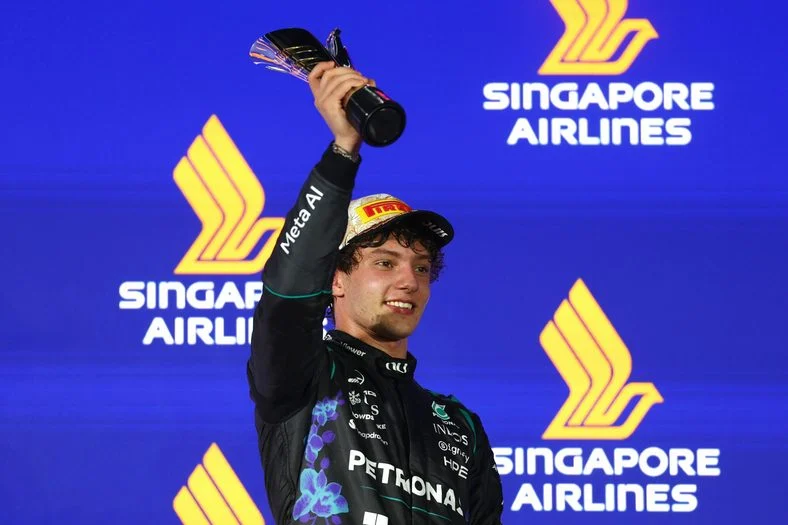 Kimi Antonelli holds up his trophy at the Singapore Grand Prix