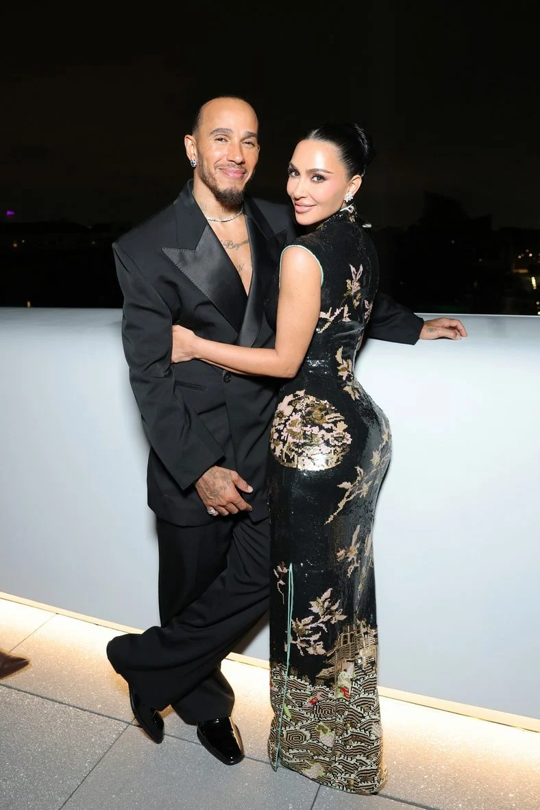 Kim Kardashian and Lewis Hamilton pose together at the opening of the Lucas Museum