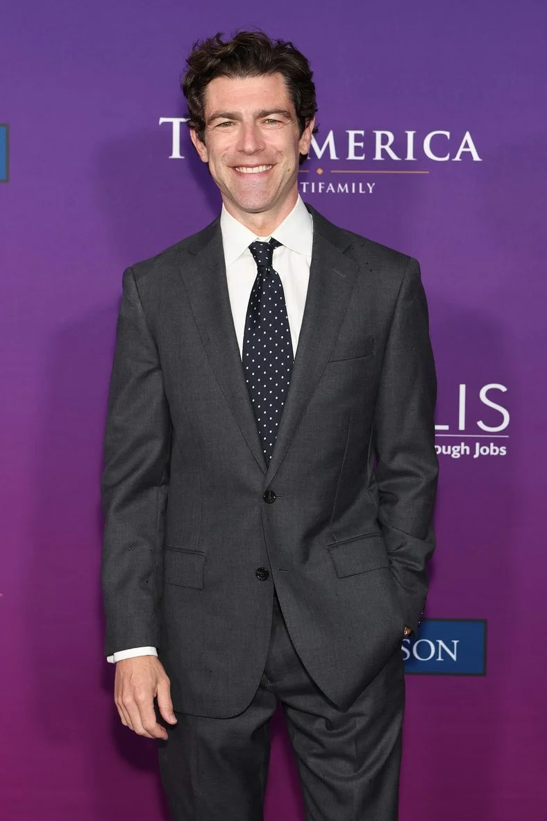 Max Greenfield standing on the carpet at the Chrysalis Butterfly Ball