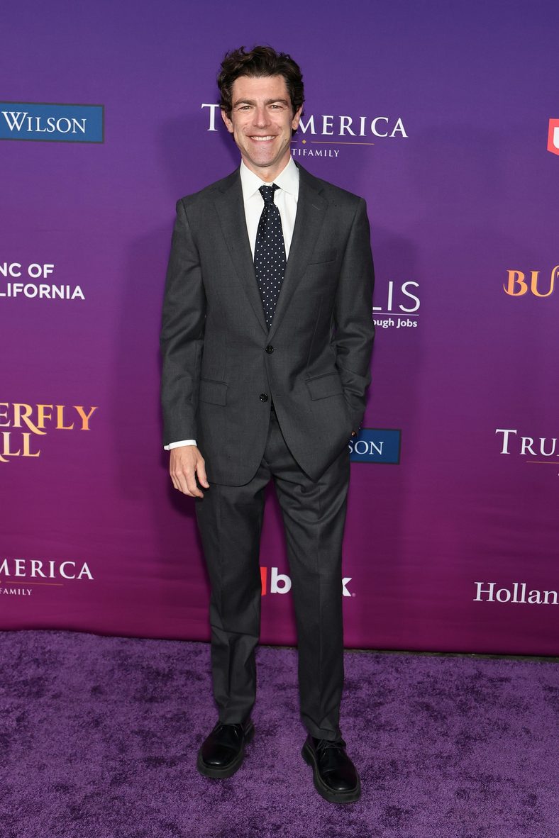 Max Greenfield standing on the carpet at the Chrysalis Butterfly Ball