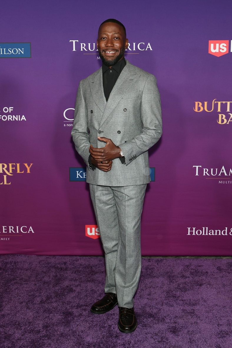 Lamorne Morris poses on the carpet at the Chrysalis Butterfly Ball