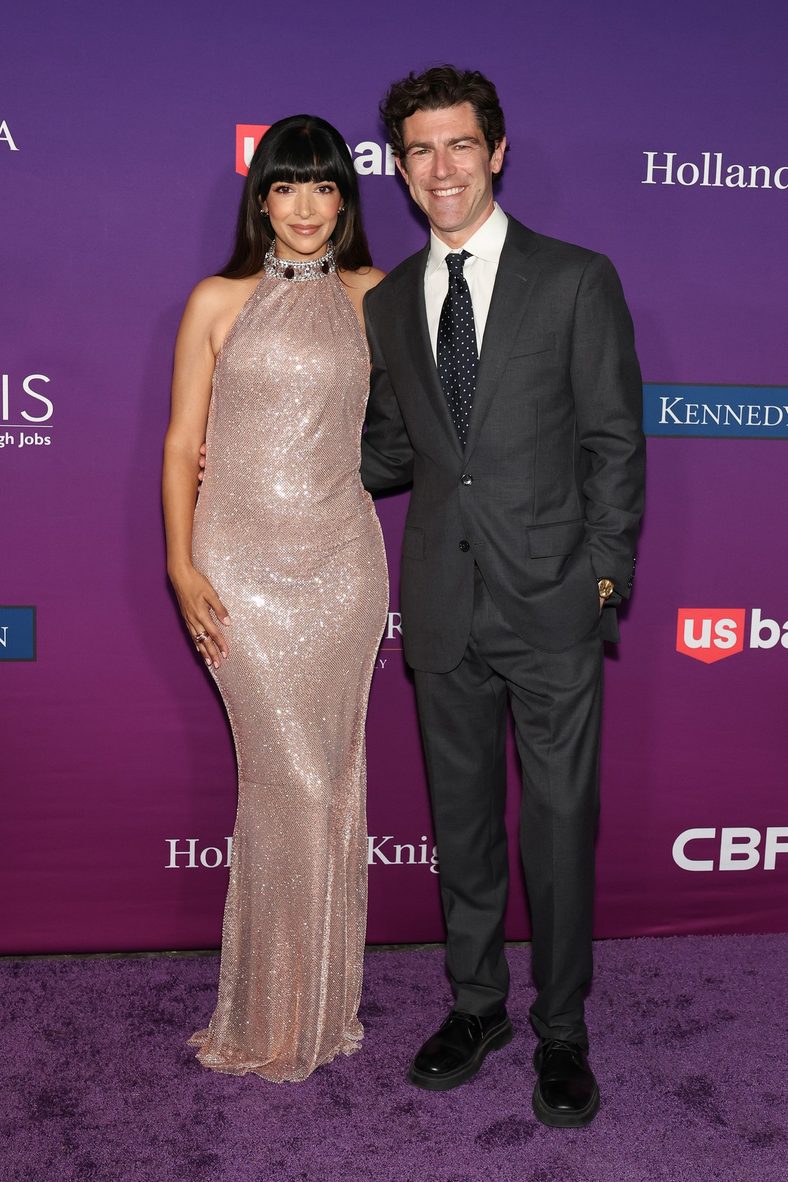 Hannah Simone and Max Greenfield pose on the carpet at the Chrysalis Butterfly Ball