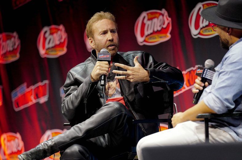 Nicolas Cage speaks on stage at the Comic Con panel in New York