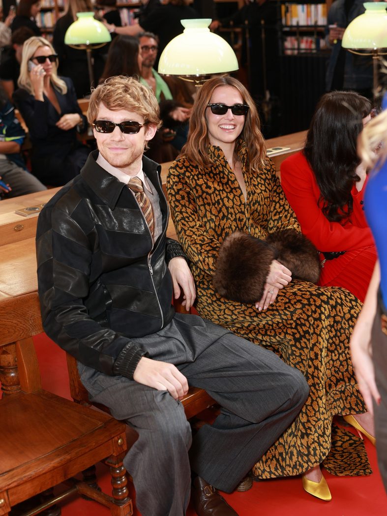 Joe Alwyn and Zoey Deutch sit front row at the Valentino fashion show